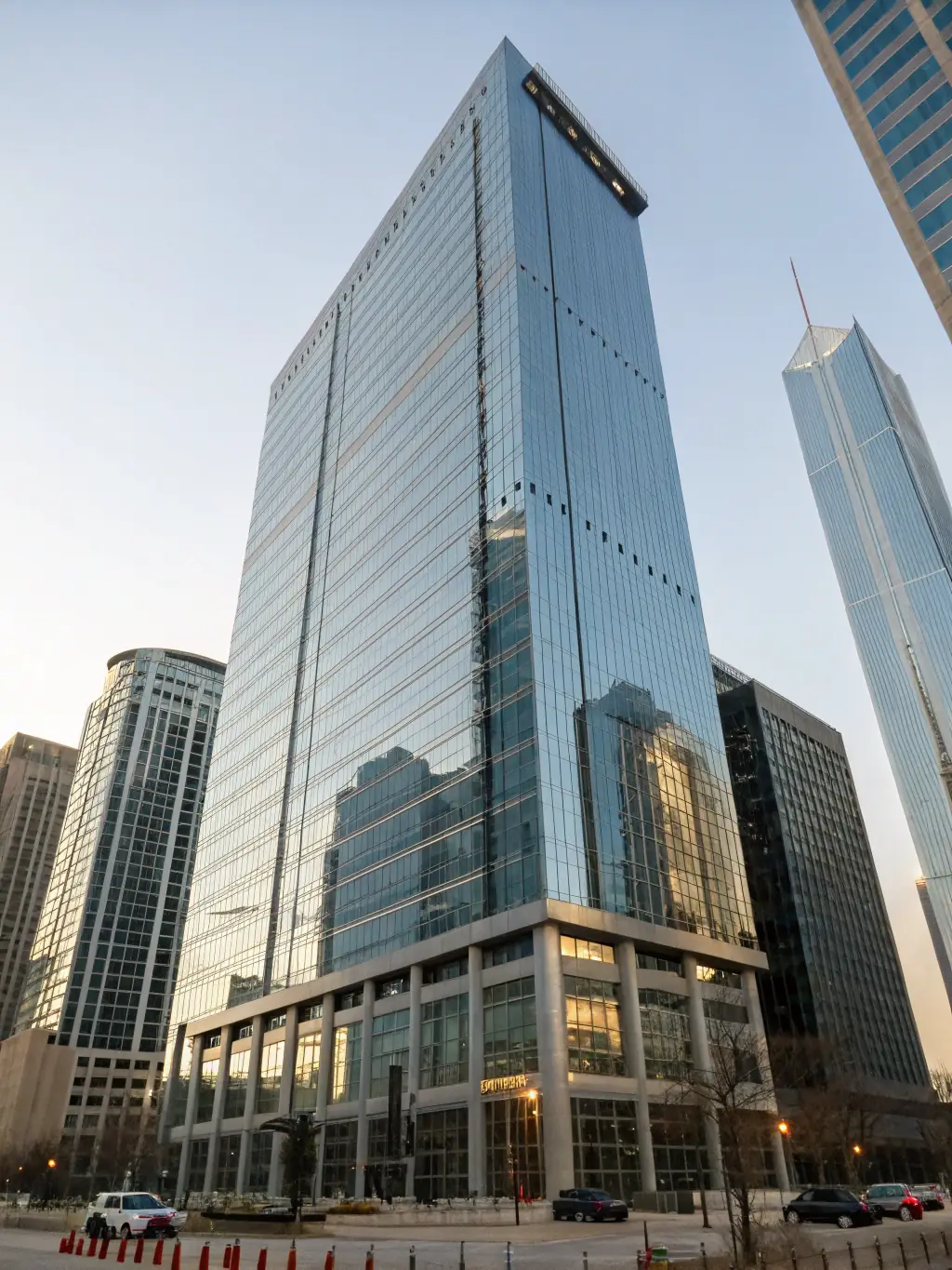 A modern office building in a Dubai free zone, showcasing a bustling business environment with international flags displayed, symbolizing global connectivity and opportunities.